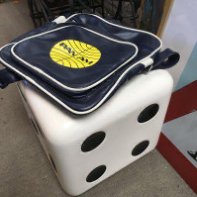 A vintage stool in the form of dice and a Pan Am bag (2). Shipping category D.