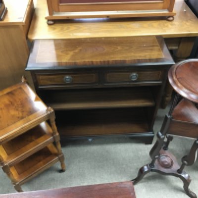 A collection of reproduction furniture including stands and a two drawer cupboard