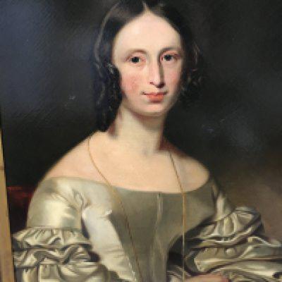 A gilt framed oil on canvas depicting a Victorian lady . 58 x76 cm .