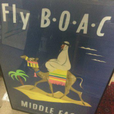 A framed poster fly B.O.A .C Middle East .