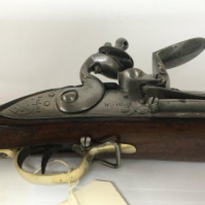A Flint lock Brown Bess Musket circa 1801-08 believed to be the New land pattern steel barrel and mechanism the action with crown mark and stamped Wright with other interesting marks of the East India Company.Brass fittings a nice example.