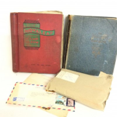 Stamp albums containing world stamps, some unused also tourist postcards and others. NO RESERVE