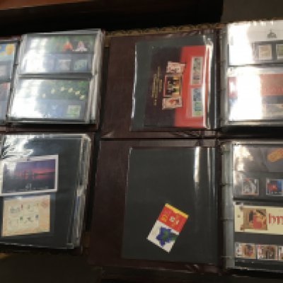 A collection of four stamp albums presentation packs. Postage C