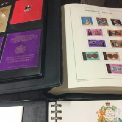 A collection of seven albums of stamps including channel Island and souvenir booklets .