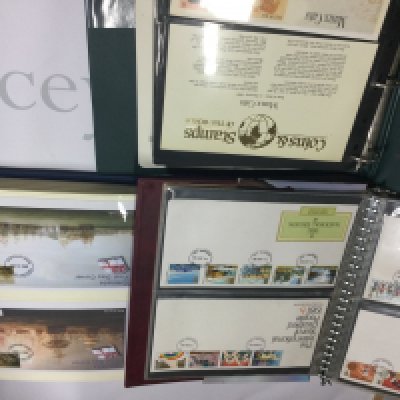 Three albums of stamps two containing first day covers the other coin covers .