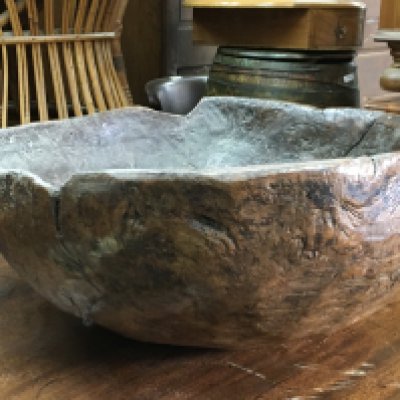 A Vernacular wooden bowl, 45cm wide. postage category C
