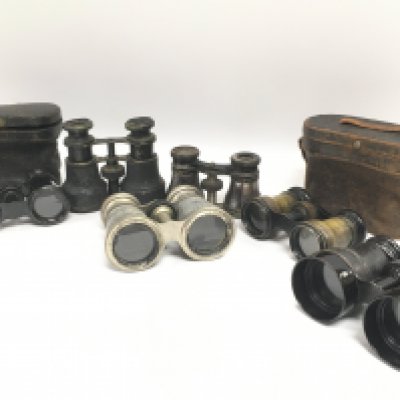 A collection of vintage binoculars and opera glasses some cased. This lot cannot be posted