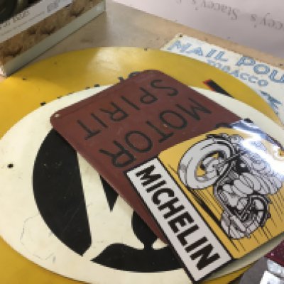 Metal motoring advertising signs and old tin American sign for mail pouch tobacco