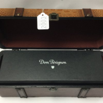 A vintage 1999 Dom Perignon 750ml sealed bottle of champagne, sealed box, with outer simulated leather bottle case. (D)