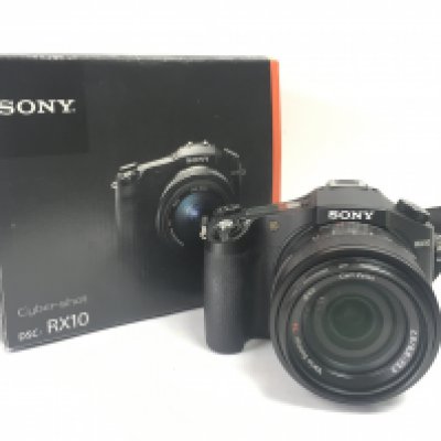 A boxed Sony RX10. Postage category C