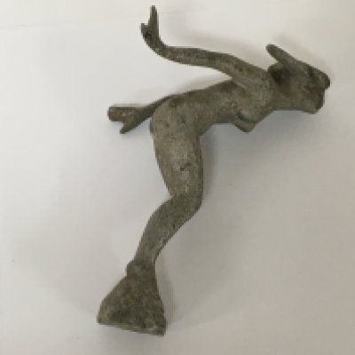 A Vintage cast aluminium car mascot in the form of a naked woman.
