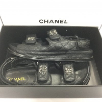 A boxed pair of Chanel style sandals. Shipping category B.