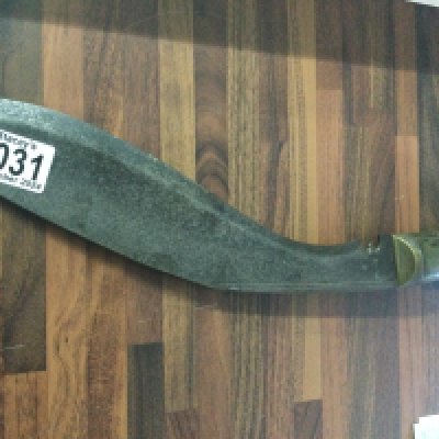 A Gurkha Kukris knife with simulated horn handle .