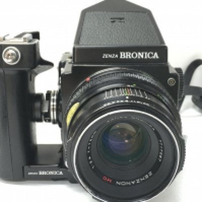 A Zenza Bronica camera with grip attachment. Postage category C