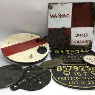 A collection of mainly railway related signs comprising a red and white signal sign, an aluminium 'limited clearance' sign, cast iron wagon plates etc. Shipping category D.