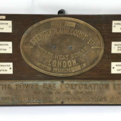 Two brass company plaques mounted on wood for Spencer Bonecourt Ltd and The Power Gas Corporation Ltd, approx 51cm x 31cm. Shipping category D.