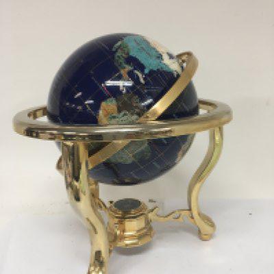 A modern specimen globe on a brass stand.