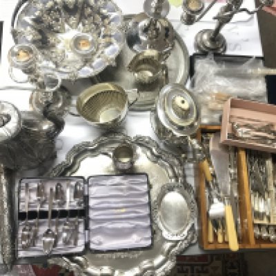 A large collection of silver plated items including tea set plated basket an Islamic scroll and cutlery etc. Postage D