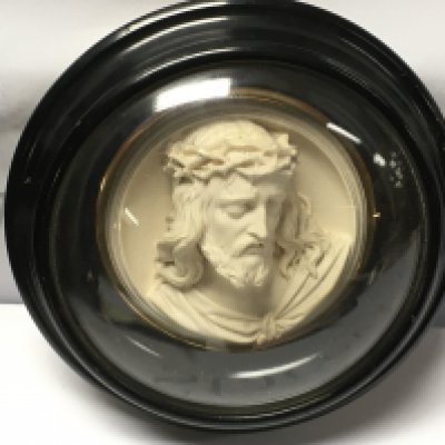 A three dimensional plaque of Jesus Christ in a wooden and glass frame , signed Ragoneau. Frame 21cm wide. This lot cannot be posted