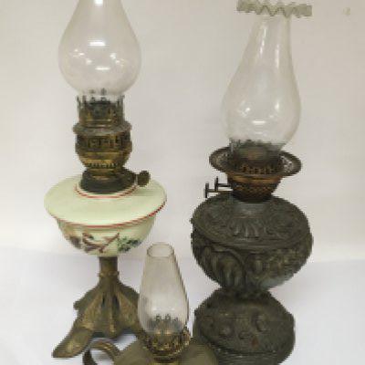 A Victorian Spelter oil lamp an opaque lamp and small brass lamp. (3)