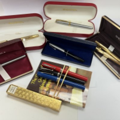A collection of various cased and uncased Sheaffer pens
