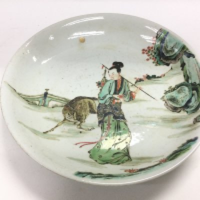 A famille rose dish decorated with figures in a landscape setting, diameter approx 28cm. Shipping category D.