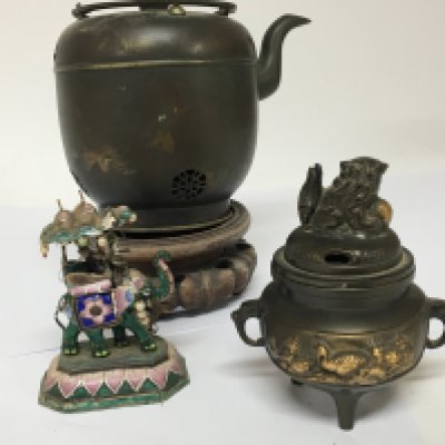 A 20th century oriental bronze koro an Indian enamel ornament in the form of an elephant and a Japanese metal tea vessel with hardwood stand (3)