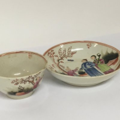 An18th century Chinese export porcelain cup and saucer decorated with figures. (2)