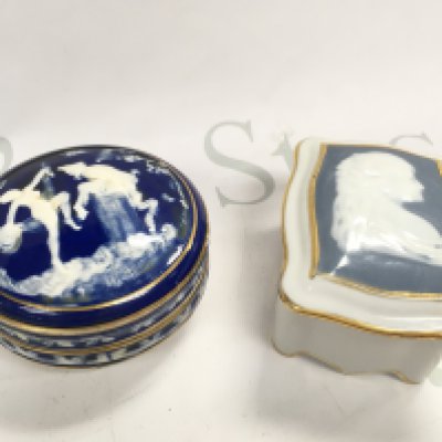 Two Limoges porcelain blue and white art nouveau trinket boxes, one decorated with figures and the other cameo style , this lot cannot be posted