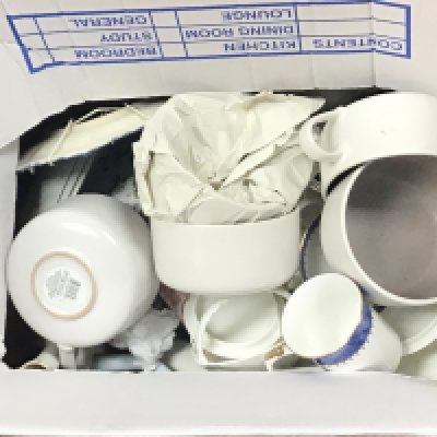 Two boxes containing decorative blue and white ceramics and other ceramics including a Lladro style figure. NO RESERVE