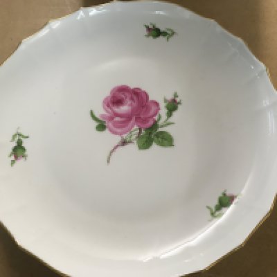 A Meissen plate decorated with flowers and foliage