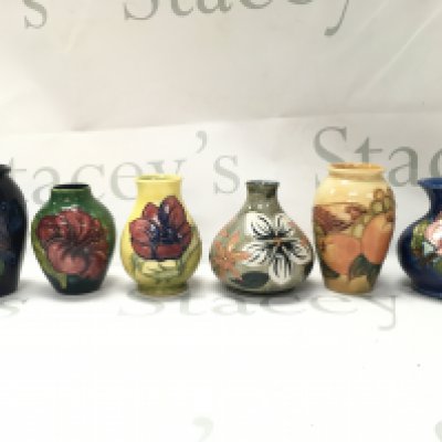 Moorcroft porcelain vases including Hibiscus, Anemone patterns. Approximately 10cm tall. No obvious damage or restoration