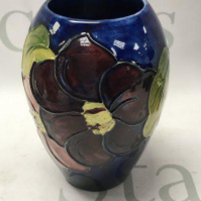 A Moorcroft vase decorated with Anenone Flowers 12 cm .no damage or restoration. NO RESERVE