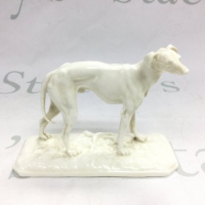 A 19th Century Nymphenburg porcelain figure of a greyhound, approx height 11cm. Shipping category D.