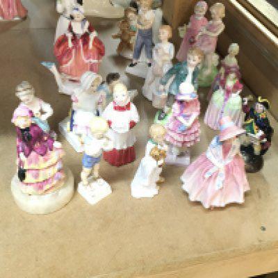 A collection of Royal Worcester and Doulton porcelain figures, also including a Dresden figure. This lot cannot be posted