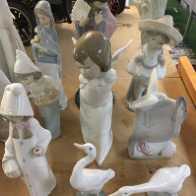 A collection of Lladro figures including angels and geisha.(9) .