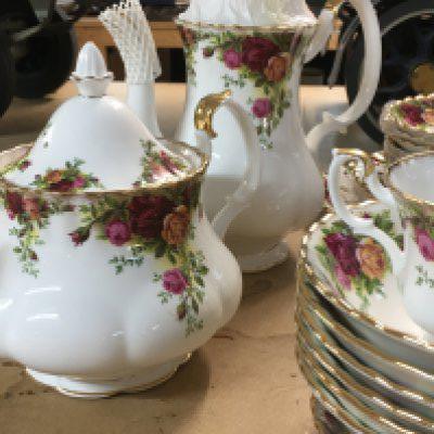 A collection of Royal Albert country rose including coffee/ tea pot dinner plates bowls cups saucers milk jug sugar bowl.