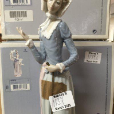 A collection of four Lladro figures