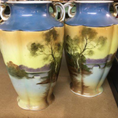 A pair of Noritake vases decorated with land scape views