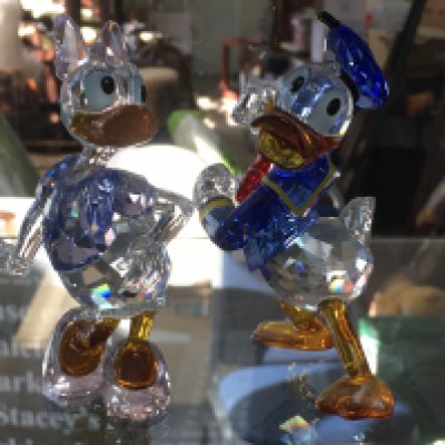 Two Swarovski Disney figures- Donald and Daisy Duck, boxed. No obvious damage or restoration