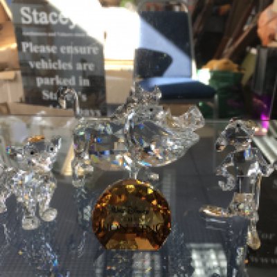 Four Swarovski Disney figures including Timone, Pumba and Child Simba, together with plaque, boxed. No obvious damage or restoration