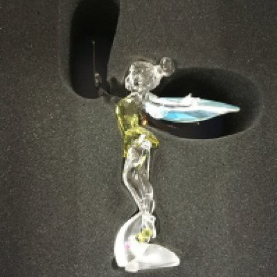 A boxed Swarovski Disney figure of Tinkerbelle, together with a boxed set of Christmas bells and one other frosted bauble. No obvious signs of damage or restoration. With Certificate