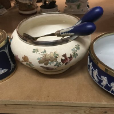 A Wedgwood salad bowl and biscuit barrel together with a Doulton bowl with silver rim .