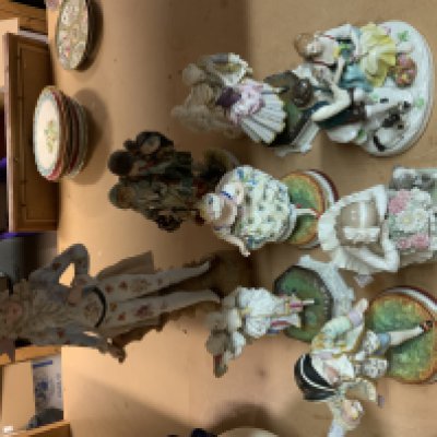 A collection of Victorian and later English and European porcelain figurines. (D)