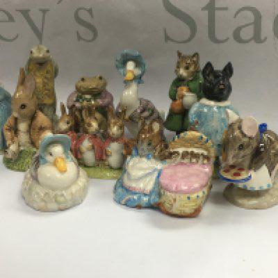 A collection of eleven Beswick Beatrix Potter figures.