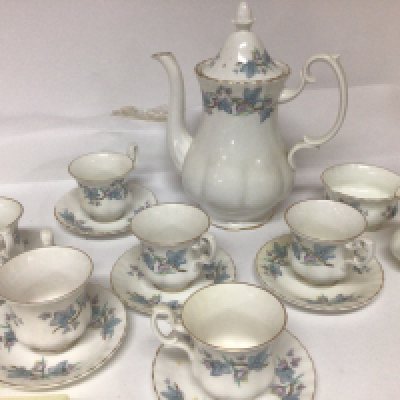 A Royal Kent bone china coffee set six place setting with coffee pot cream jug and sugar bowl with chipped edge.