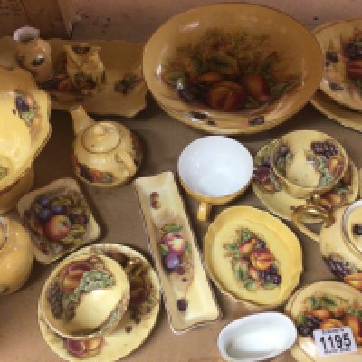 A large collection of Aynsley bone china porcelain The Orchard Gold pattern decorated with scenes of still life fruit and foliage. Bowls tea pots candle sticks a clock vases and others