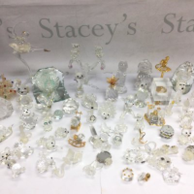 A collection of Swarovski and other glass ornaments. Shipping category D.