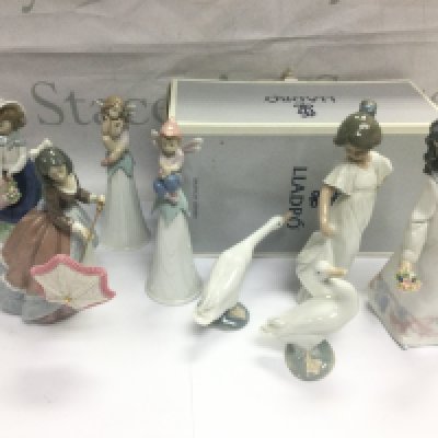 A collection of Lladro and Nao figures including one boxed example. Shipping category D.