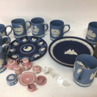 A Miniature Wedgwood pink glazed tea set Wedgwood jasper-ware mugs two plates (one damaged) and Swarovski Crystal ornaments.